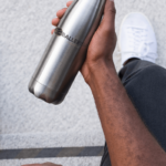 mockup-of-a-man-holding-an-aluminum-bottle-in-his-hand-33522-1